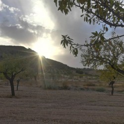 The sunsetting behind the mountain