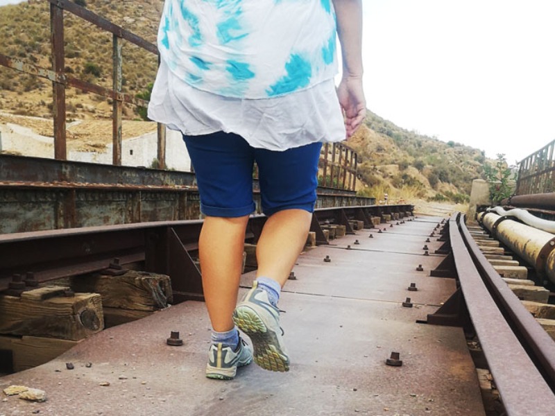 You can walk over, or under the bridge
